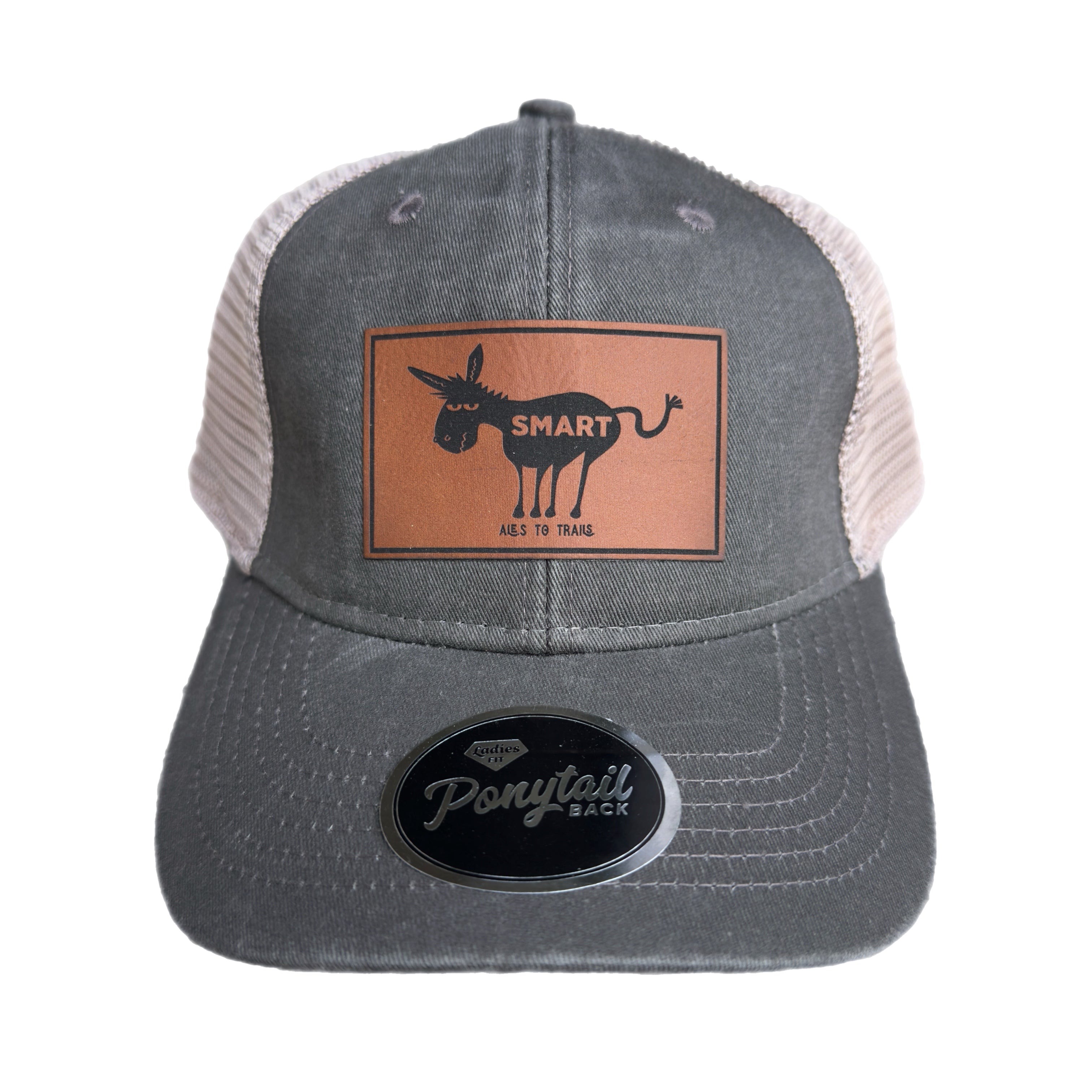 Gray ponytail trucker cap with a brown leather patch that says " smart ass"